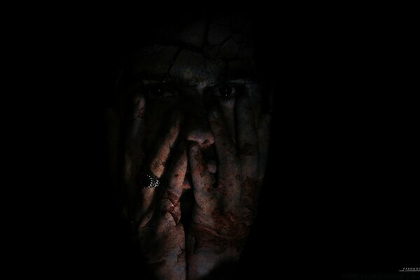 Creepy portrait on a black background