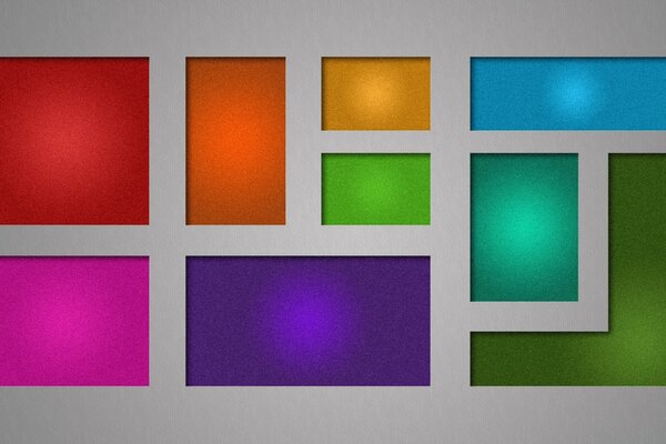 Sobre un fondo gris, cuadrados de colores brillantes y formas rectangulares