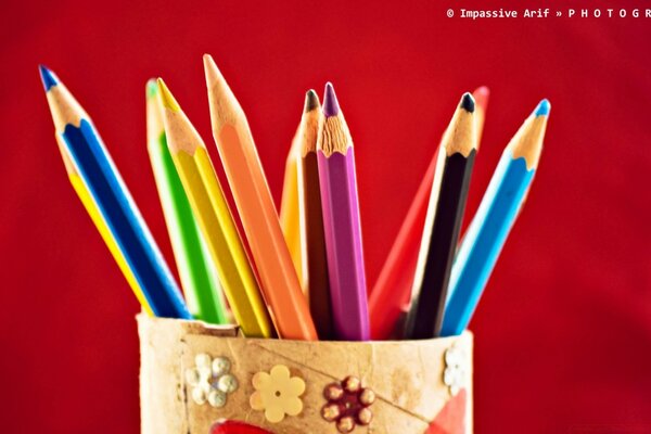 Colorful pencils in a glass