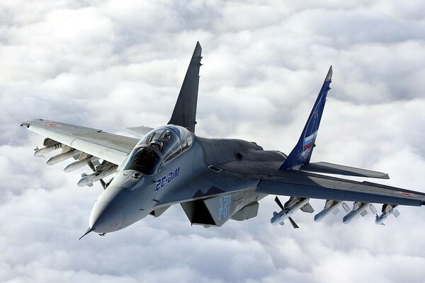 MIG-32 fighter in flight against the background of clouds