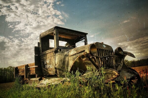 An abandoned car in the fields. The collapse of the Soviet Union