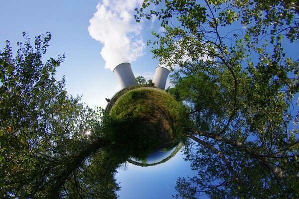 Trees and smokestacks against the sky