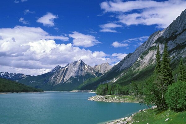 Clouds in a blue lake in the mountains