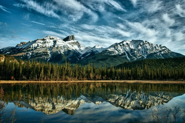 Reflection of mountains in a crystal clear lake