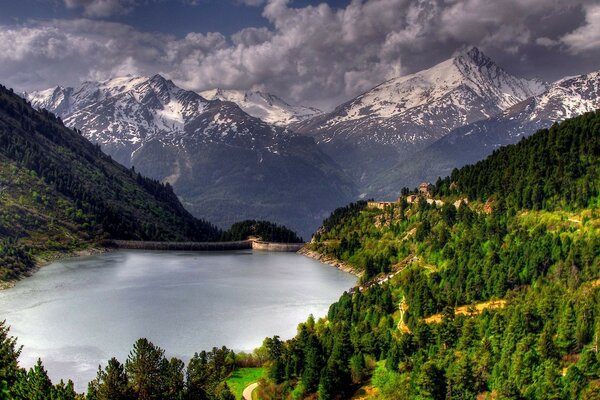 Alpine lake with a view of the ice peaks