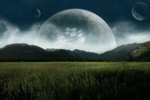 Grass and mountains on the background of a large moon