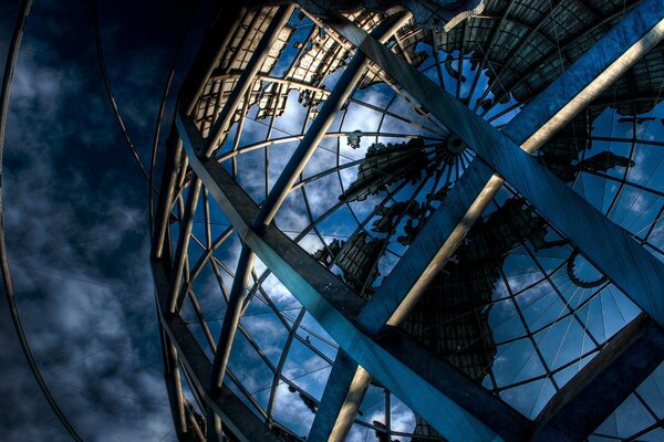 Architectural structure made of glass against the sky