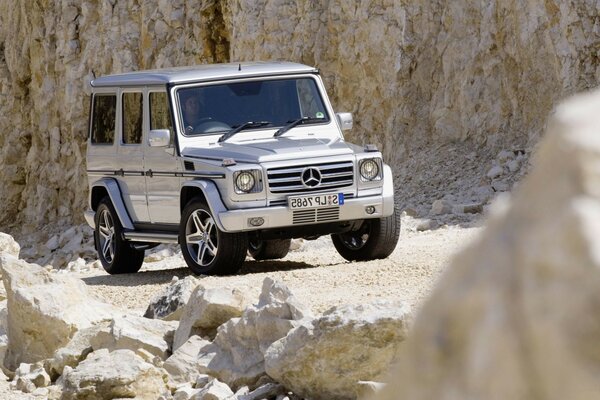 Mercedes silver car in the rocks