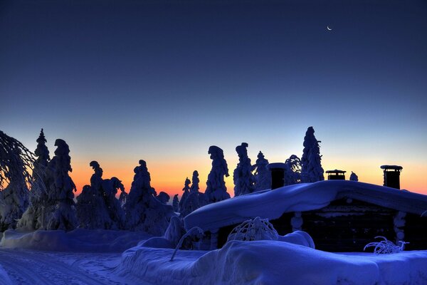 The moon shines on a frosty night