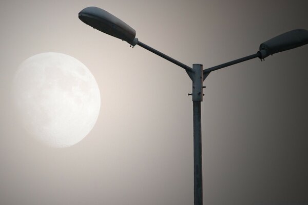 A lonely lantern on the background of a beautiful moon