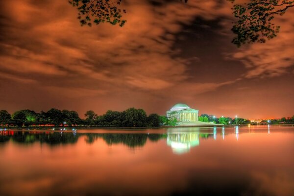 Red glow from sunset. House on the shore