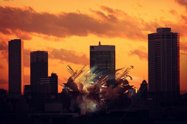 Explosion against the background of the city at sunset