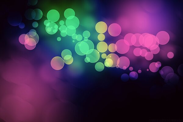 Bright multicolored bubbles on a blurry background