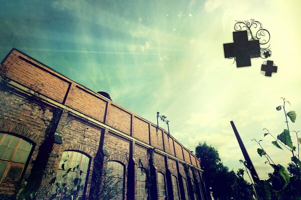 Crematorium. An old red brick building. Crosses in the sky