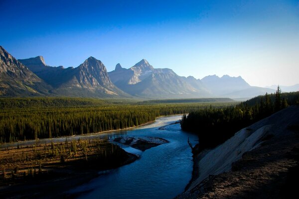 A river or stream near the mountains