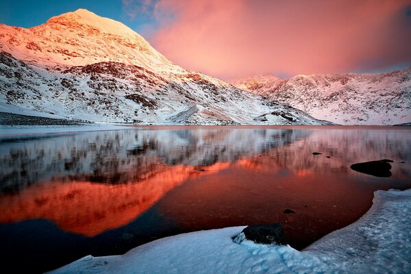 Beautiful landscape. Lake. Mountains. Snow