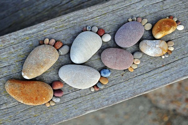 Funny sculpture made of river stones