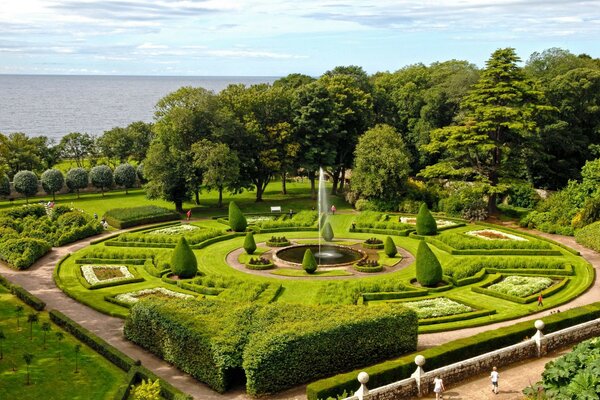 Beautiful park with fountain and lawns