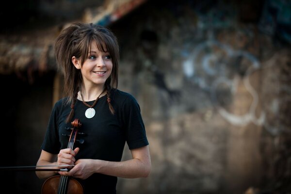 A female musician is alone in nature