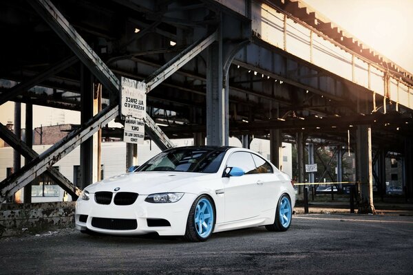 A white car at the factory buildings