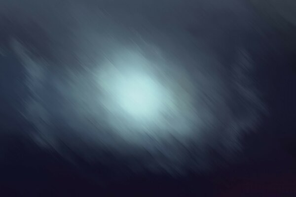 A blurred moon in a foggy night