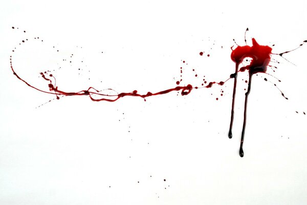 Spreading red liquid on a white background