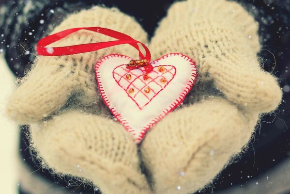 A heart on mittens on Valentine s Day