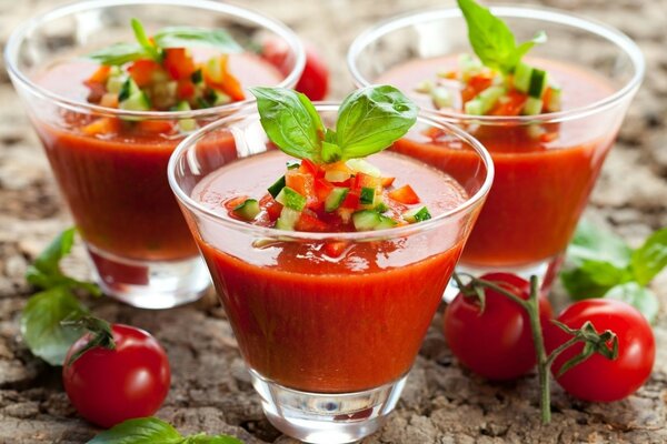 An interesting drink and tomato with rosemary leaves