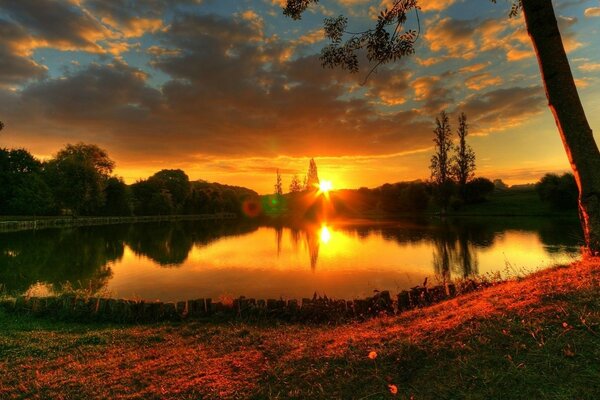 Summer sunset on the lake shore