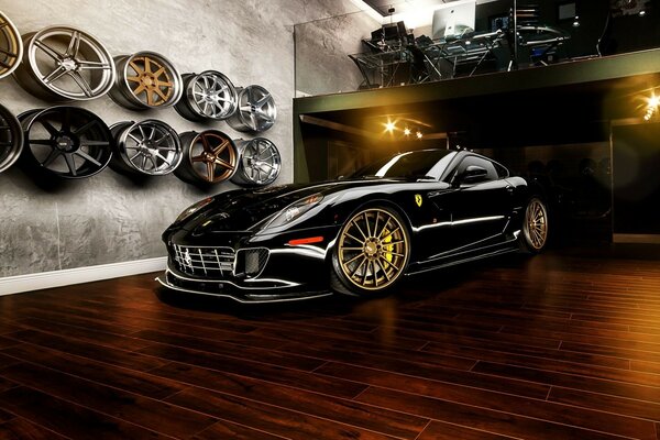 Black sports car with gold wheels