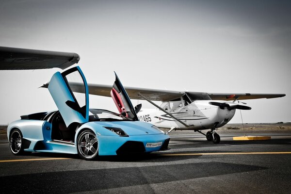 A sports car and an airplane on the take-off platform