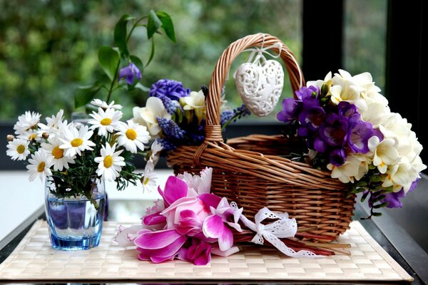 There is a bouquet of flowers in the basket