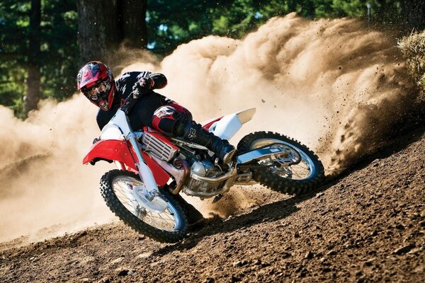 Motorcyclist rushes off-road racing