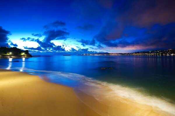 Evening transparent sea on the background of the city