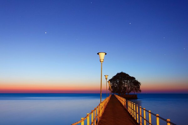 Bridge over the river at sunset landscape