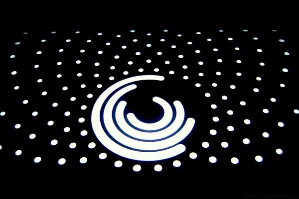 White dots and pattern on black background