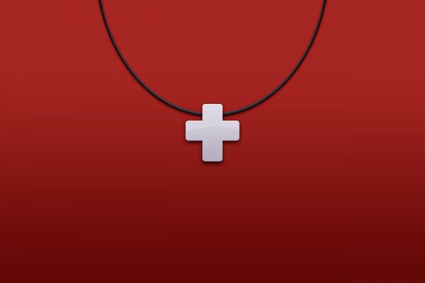 Cross on a rope on a red background