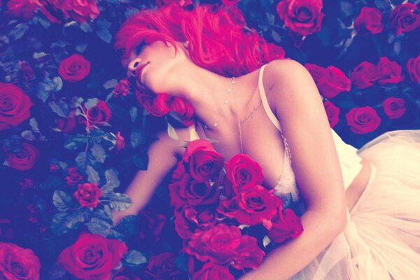 A beautiful girl lies in a clearing with roses