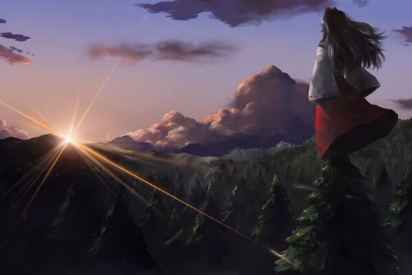 A painted girl looks at the sunset in the mountains