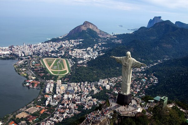 A city from the air with a statue of Christ