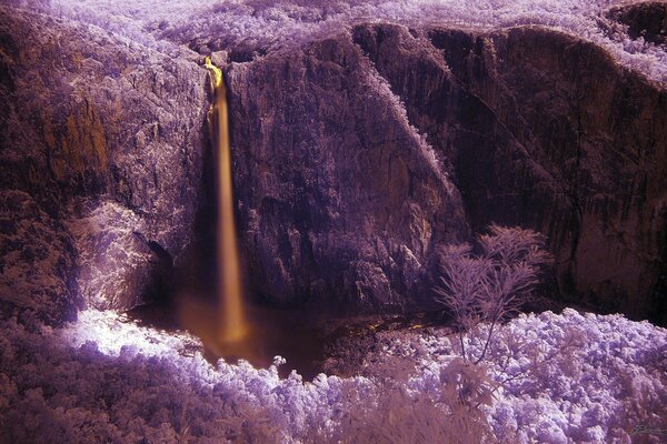 An unusual beautiful landscape of mountains and foliage in purple shades