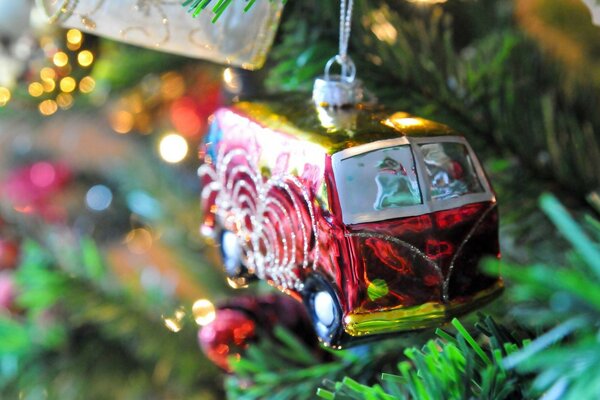 Toy car on spruce branches