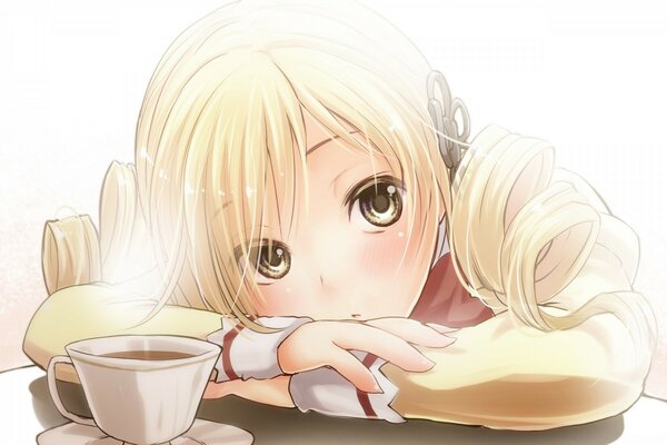 A cup of tea near a dreamy girl