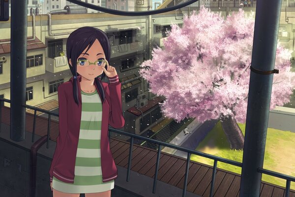 An adult business woman against the background of sakura is ready for a portrait