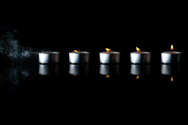 Candle fading on a black background