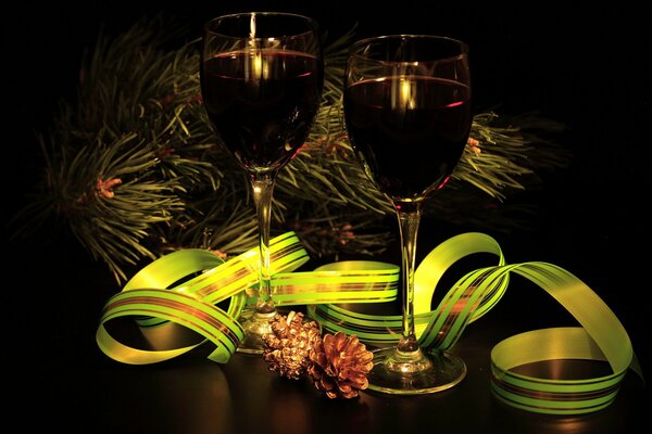 Wine glasses on the background of a fir tree