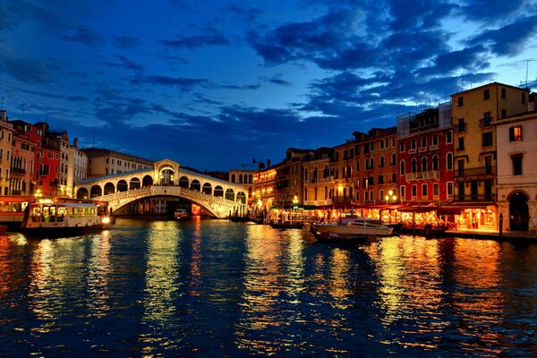 Cozy city on the river in the evening