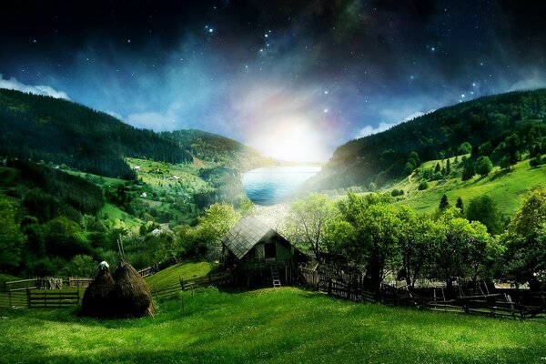 Green landscape of a cottage in the village on the background of green grass and mountains