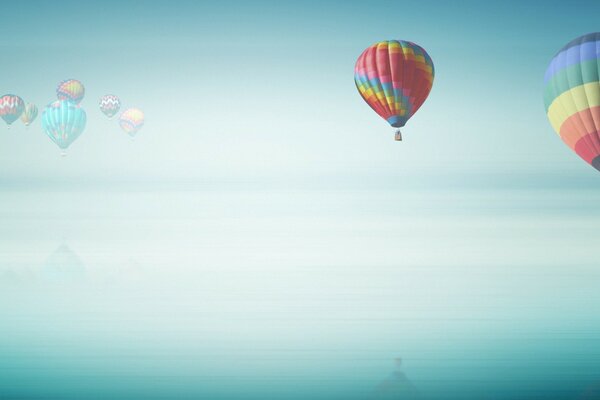 A group of colorful balloons in the sky