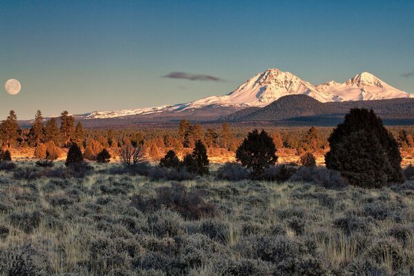 Beautiful mountain landscape under the Moon